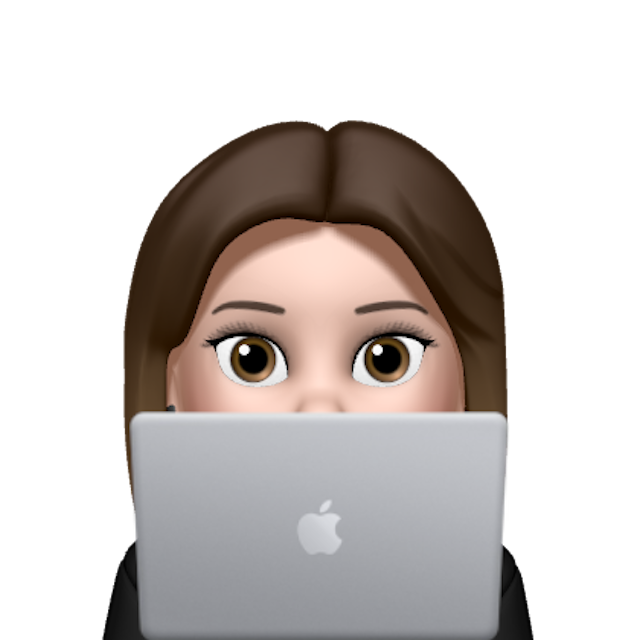 A girl's face behind a computer